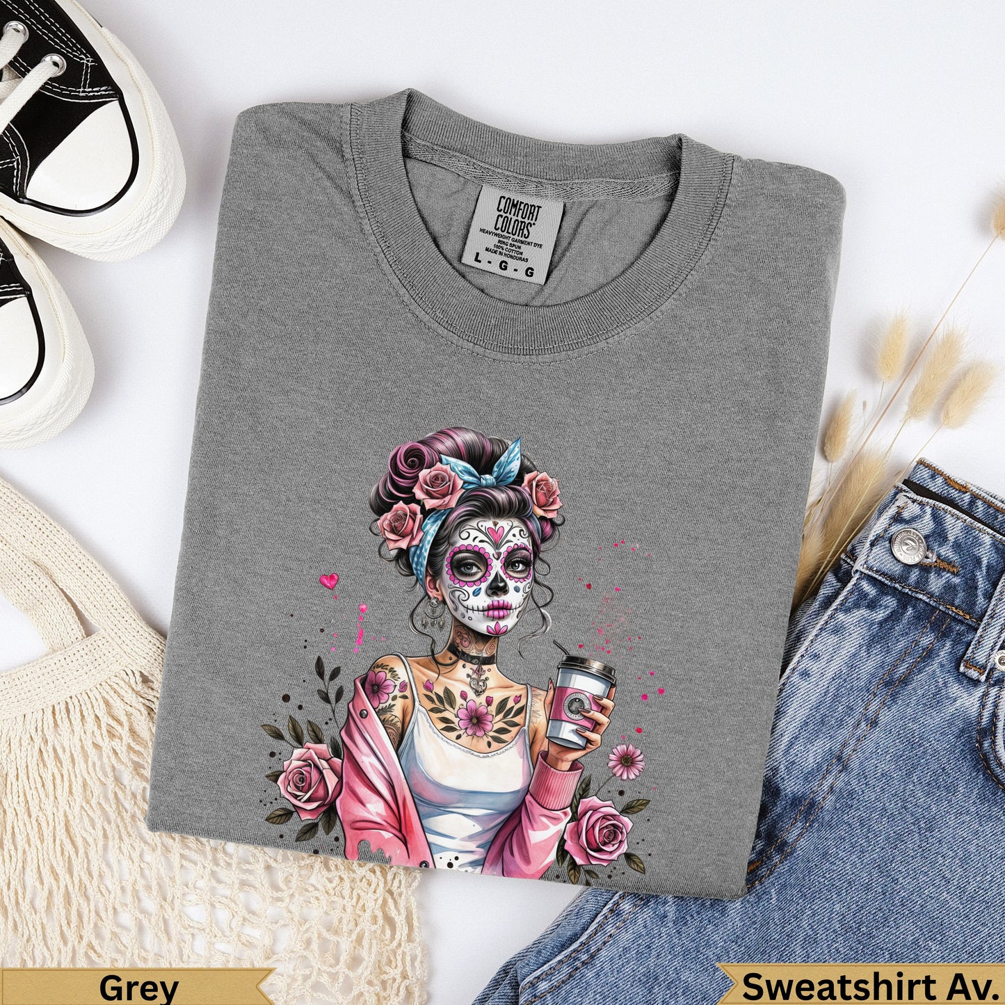 Grey sweatshirt with a woman's skull face in Dia de los Muertos style.