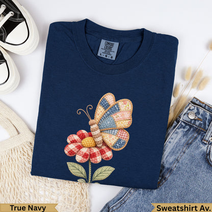 Navy blue long-sleeve sweatshirt with a quilted butterfly and flower graphic.