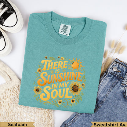 Teal t-shirt with "There is sunshine in my soul" and sunflowers graphic.
