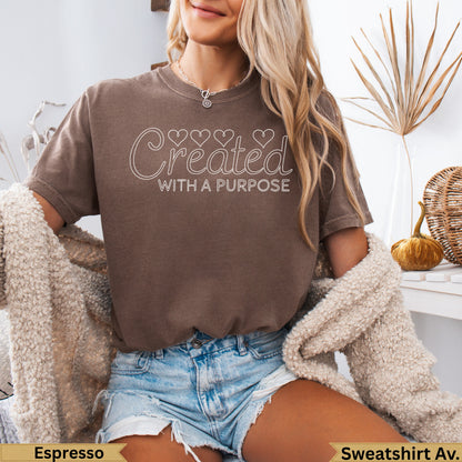 Brown t-shirt with "Created With A Purpose" text, shown on a person.
