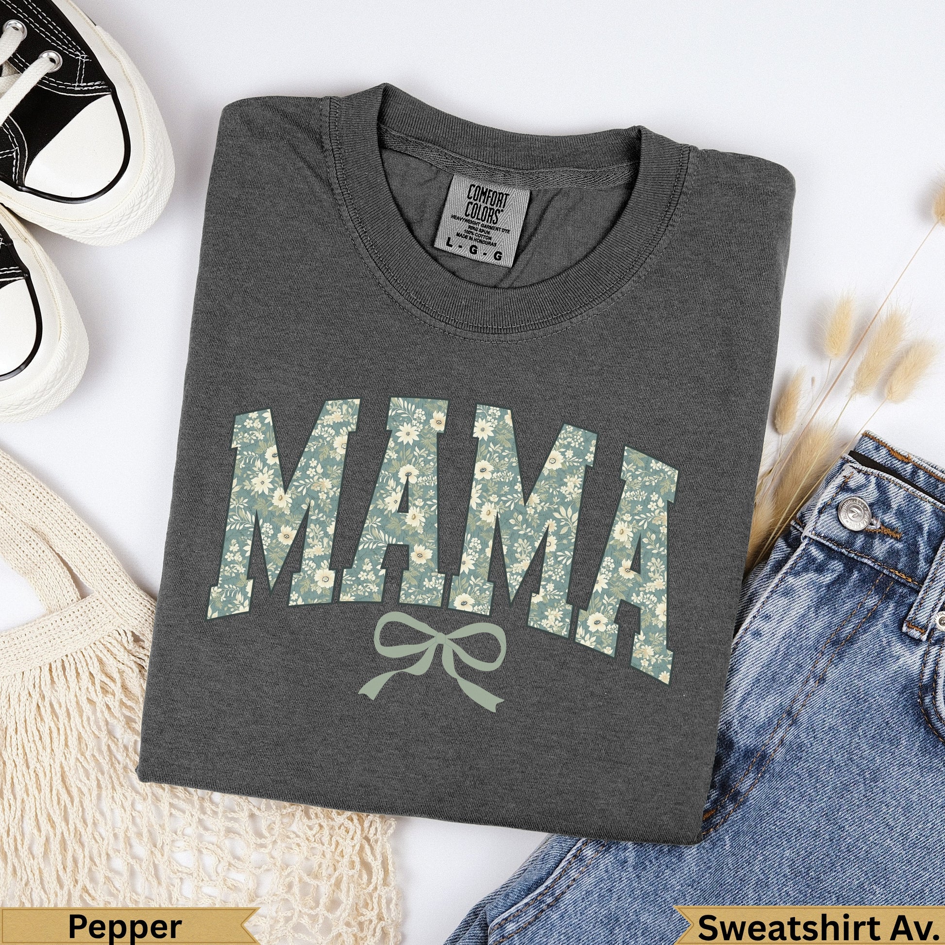 Dark gray "MAMA" graphic sweatshirt with floral pattern and bow.