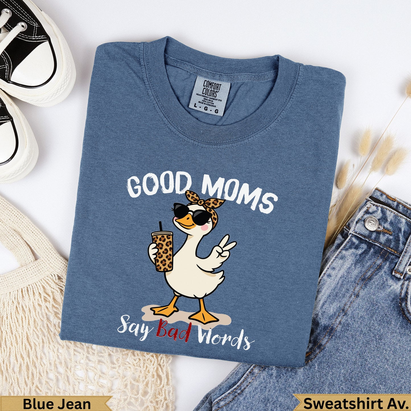 Blue t-shirt with cartoon goose wearing sunglasses saying "Good Moms Say Bad Words."