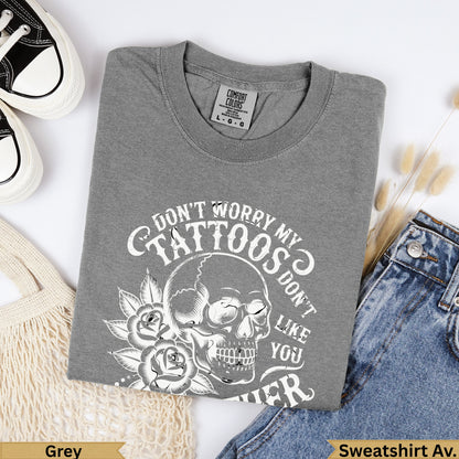 Grey crewneck sweatshirt with skull, roses, and "Don't worry my tattoos don't like you either" text.