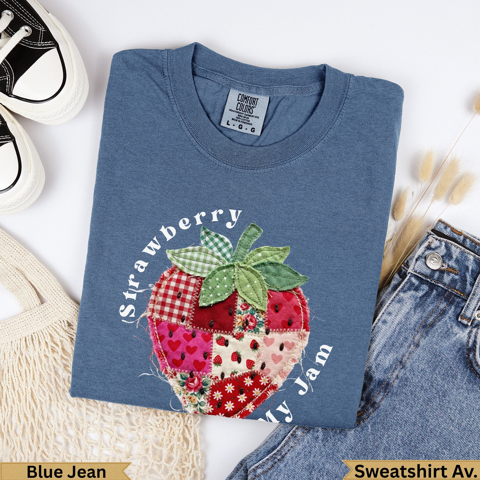 Blue Jean Comfort Colors sweatshirt with a patchwork strawberry and "Strawberry ly Jam" text.