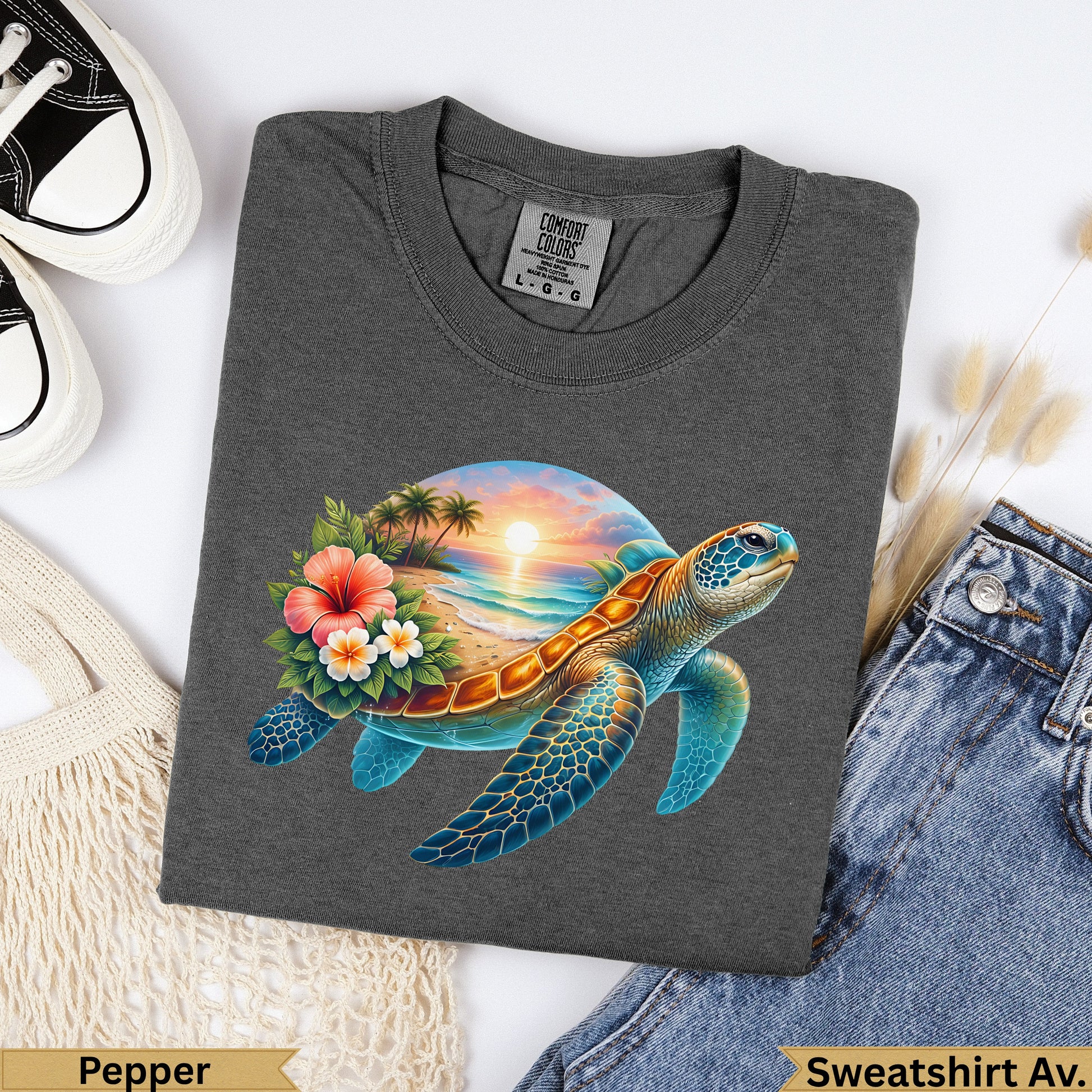 Dark gray t-shirt with a sea turtle and sunset beach graphic.