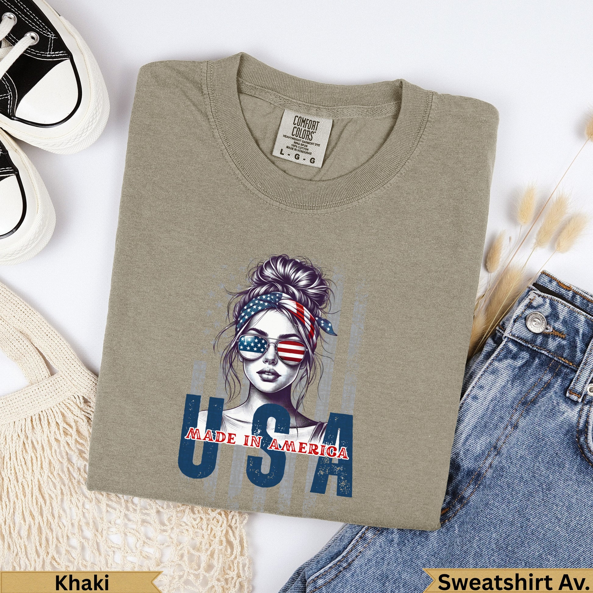 Khaki crewneck sweatshirt with "USA MADE IN AMERICA" graphic featuring a woman.