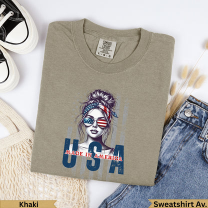 Khaki crewneck sweatshirt with "USA MADE IN AMERICA" graphic featuring a woman.