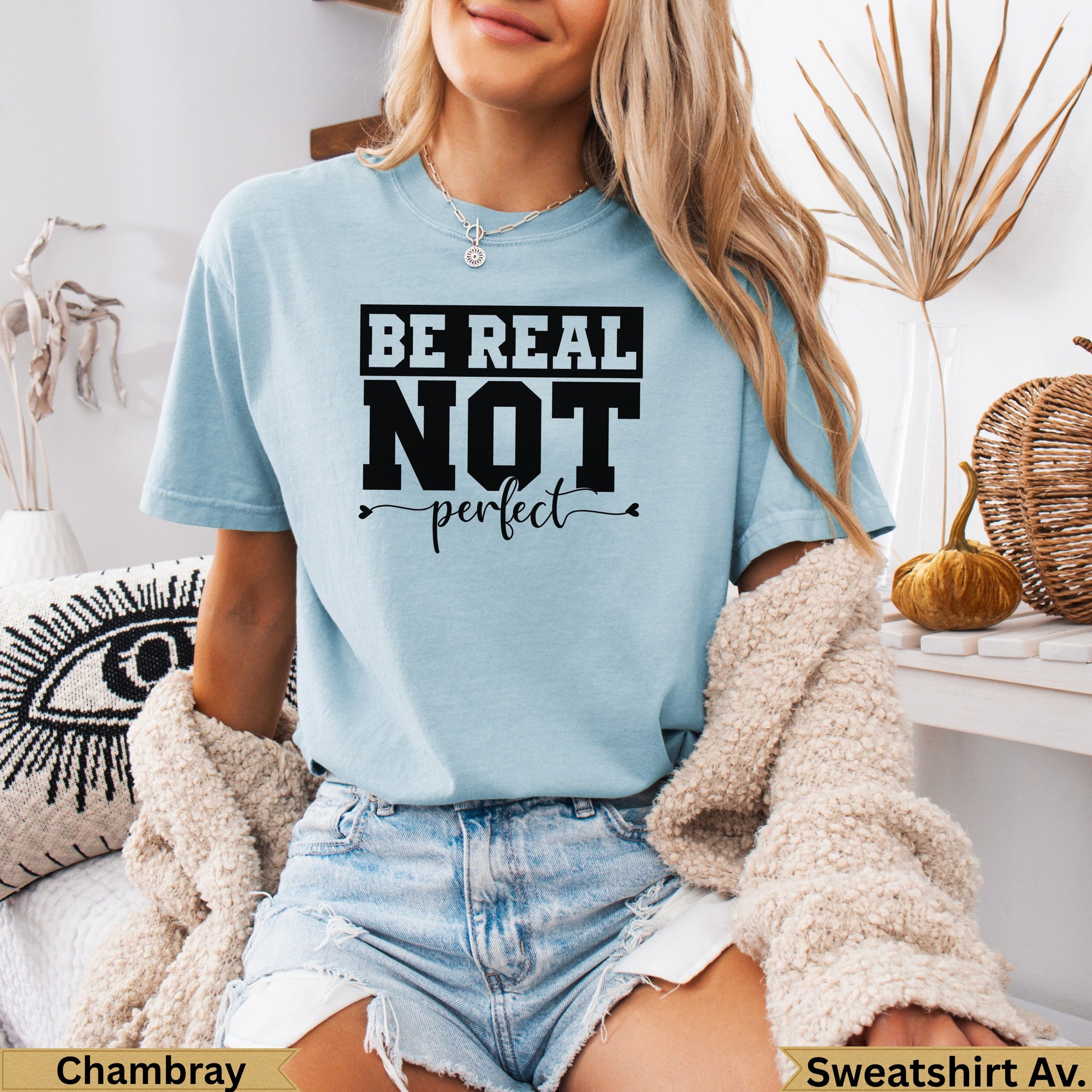 Light blue t-shirt with "BE REAL NOT perfect" text graphic.