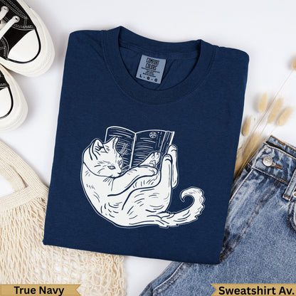 Navy blue sweatshirt with white cat reading a book graphic and "True Navy" text.