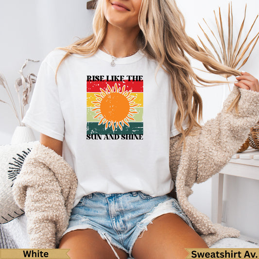 White t-shirt with "Rise Like the Sun" and "Sun and Shine" text and sun graphic.