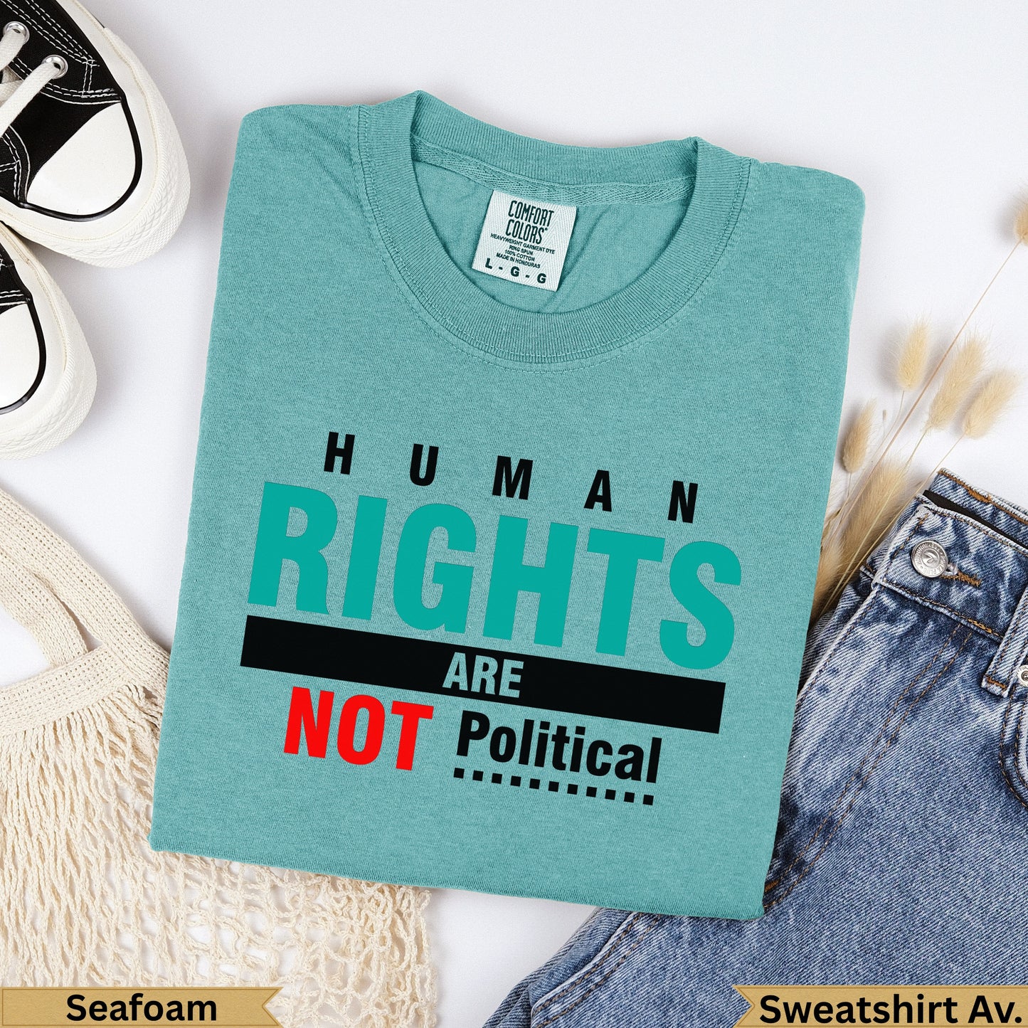 Teal t-shirt with "HUMAN RIGHTS ARE NOT Political" text.