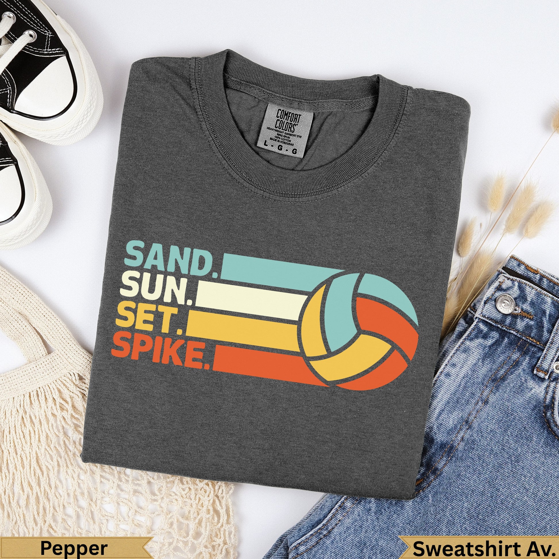 Charcoal t-shirt with "SAND. SUN. SET. SPIKE." text and volleyball graphic.