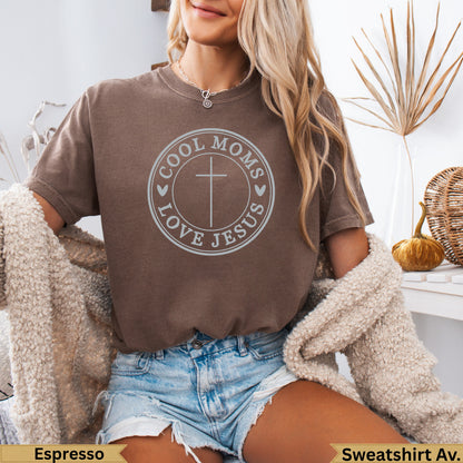 Brown t-shirt with "Cool Moms Love Jesus" text and cross design.