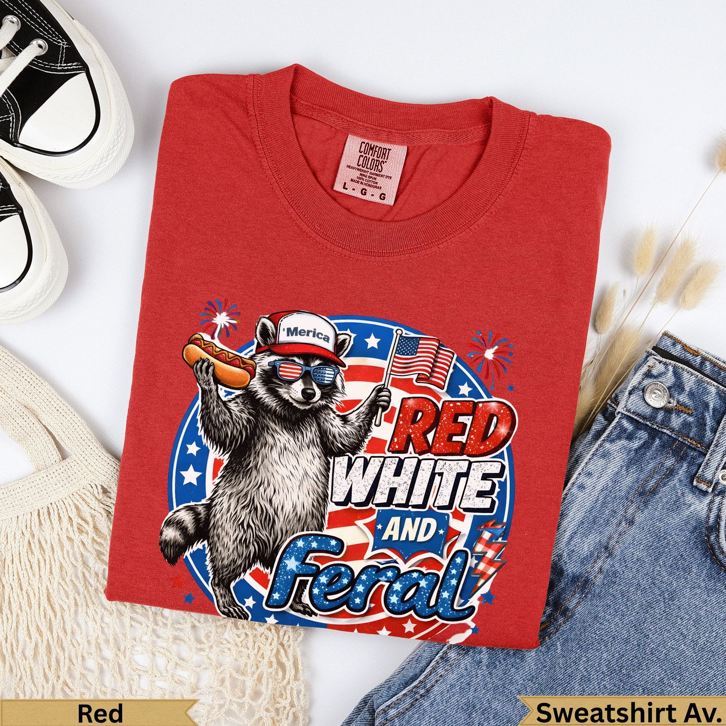 Red T-shirt with raccoon, hot dog, "Merica" and "Red White and Feral" text.