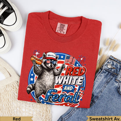 Red T-shirt with raccoon, hot dog, "Merica" and "Red White and Feral" text.