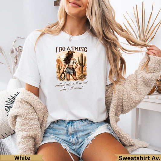 White graphic t-shirt with desert scene and text "I do a thing called what I want when I want."