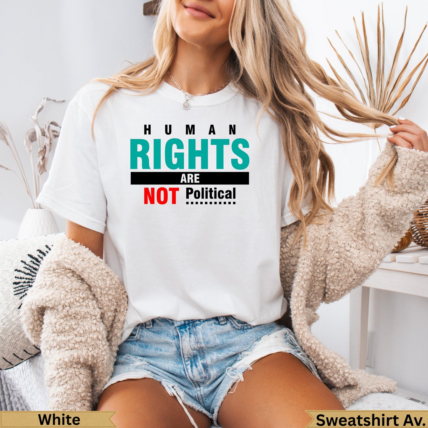 White t-shirt with "HUMAN RIGHTS ARE NOT Political" text.