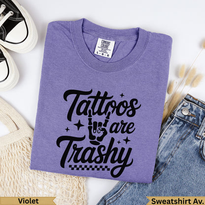 Purple t-shirt with "Tattoos are Trashy" graphic and checkered border.