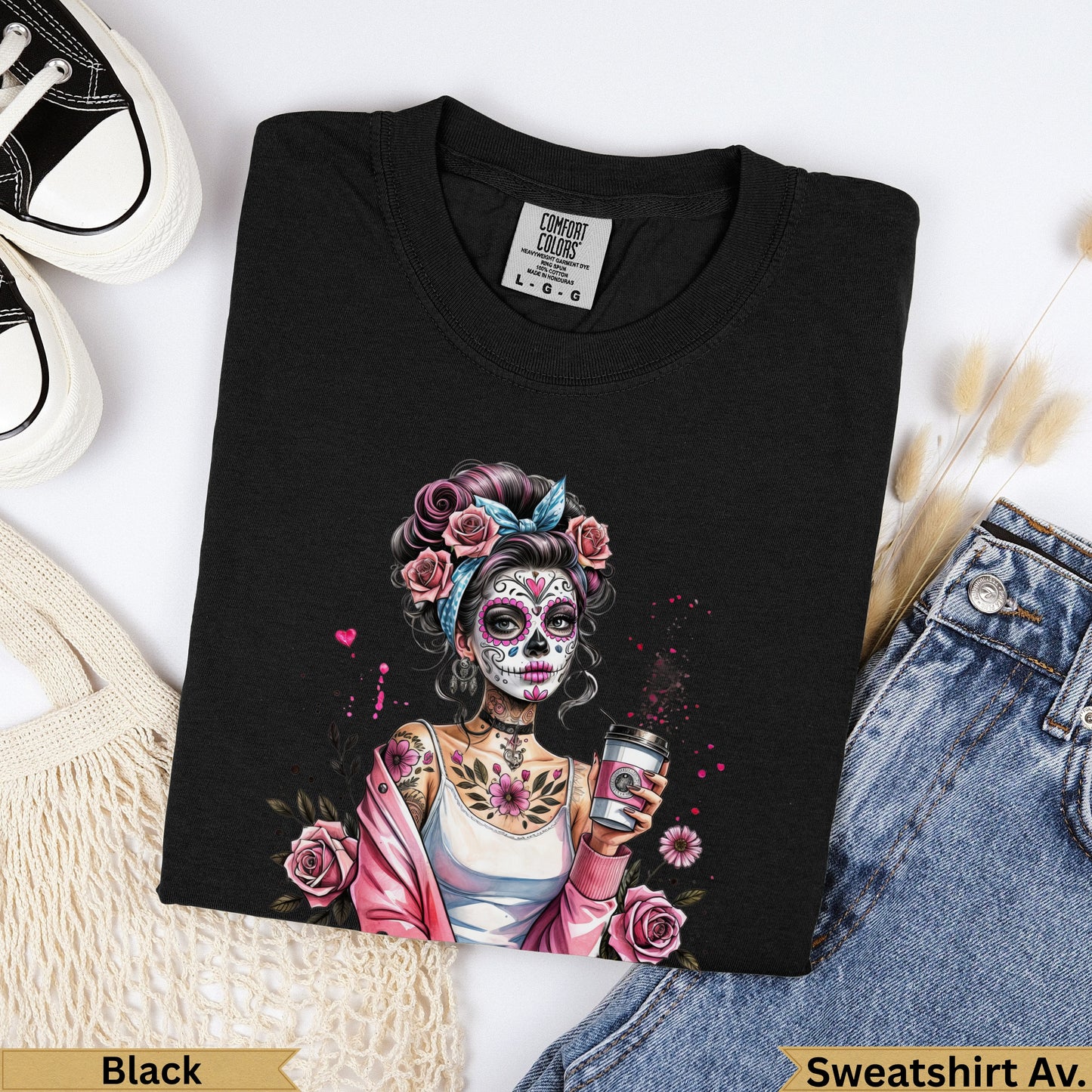 Black t-shirt with colorful sugar skull graphic holding a coffee cup.