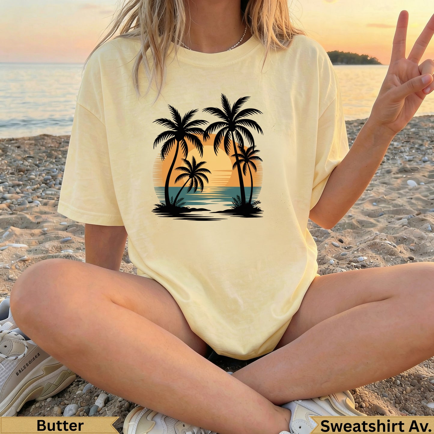Yellow t-shirt with a sunset beach and palm tree graphic.