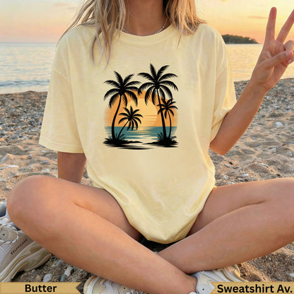 Yellow t-shirt with a sunset beach and palm tree graphic.