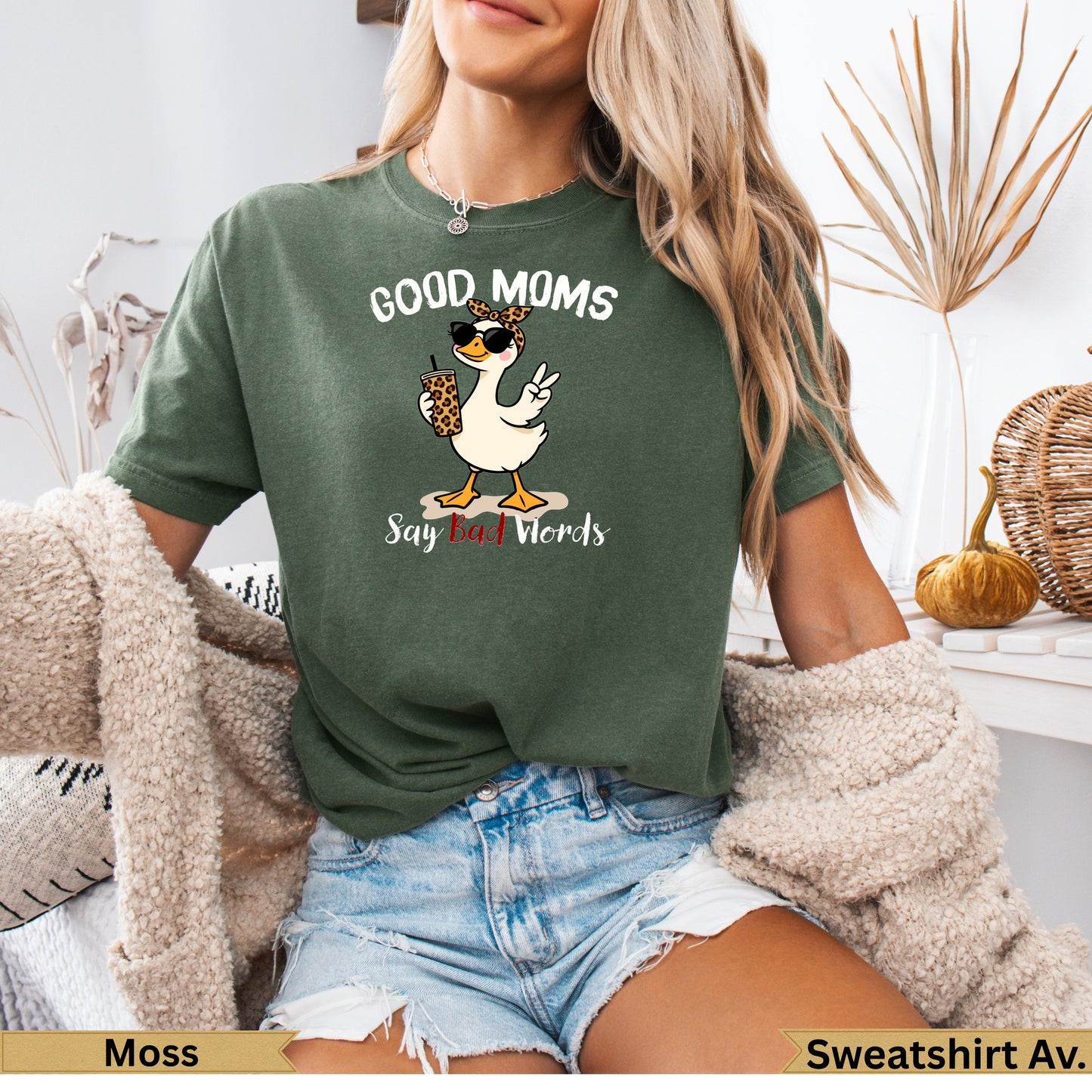 Green t-shirt with a duck wearing sunglasses and leopard print saying "Good Moms Say Bad Words".