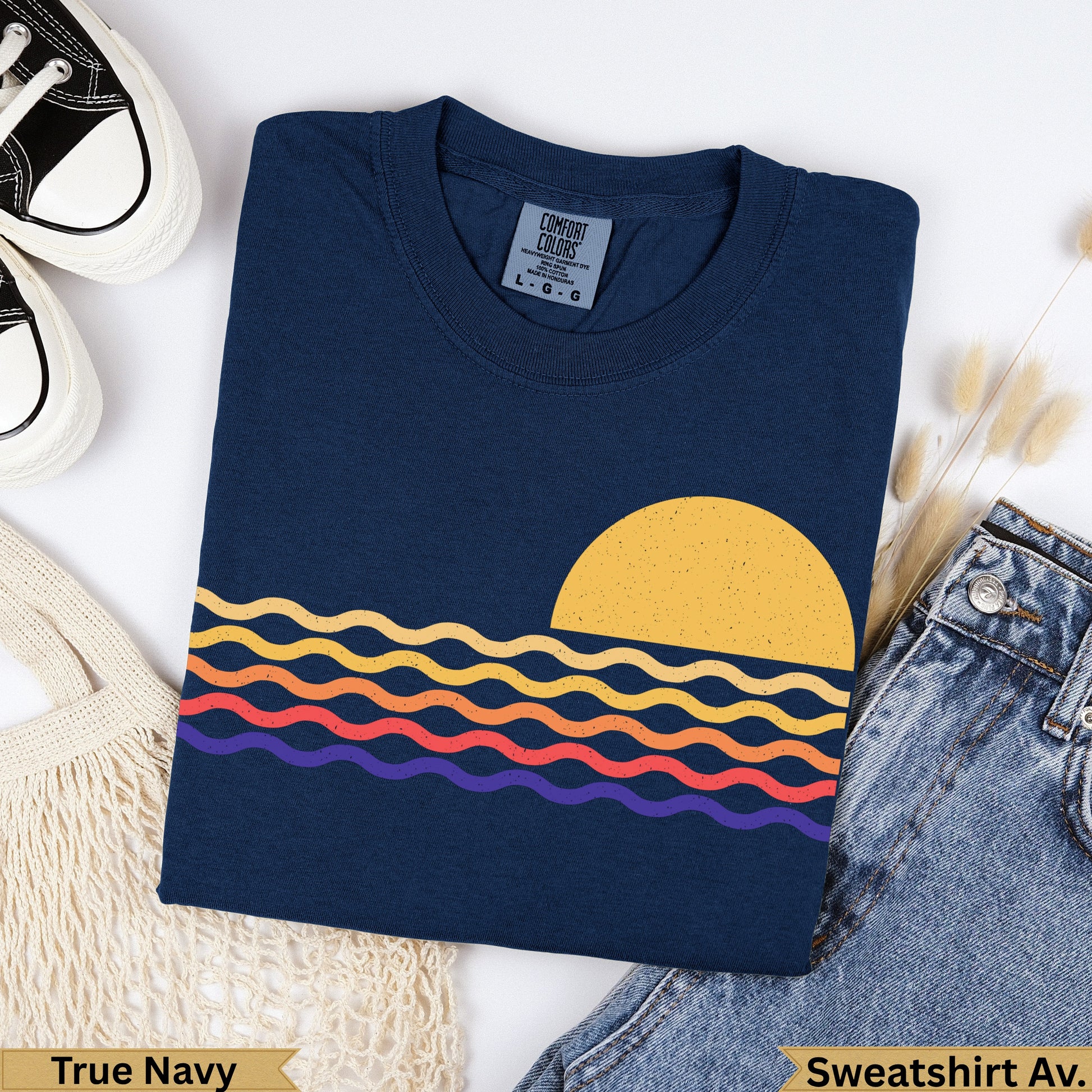 Navy blue t-shirt with wavy sunset graphic and "True Navy" text.