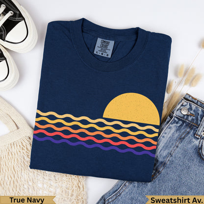 Navy blue t-shirt with wavy sunset graphic and "True Navy" text.