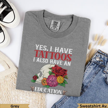 Grey sweatshirt with "Yes, I Have Tattoos" and floral skull graphic.