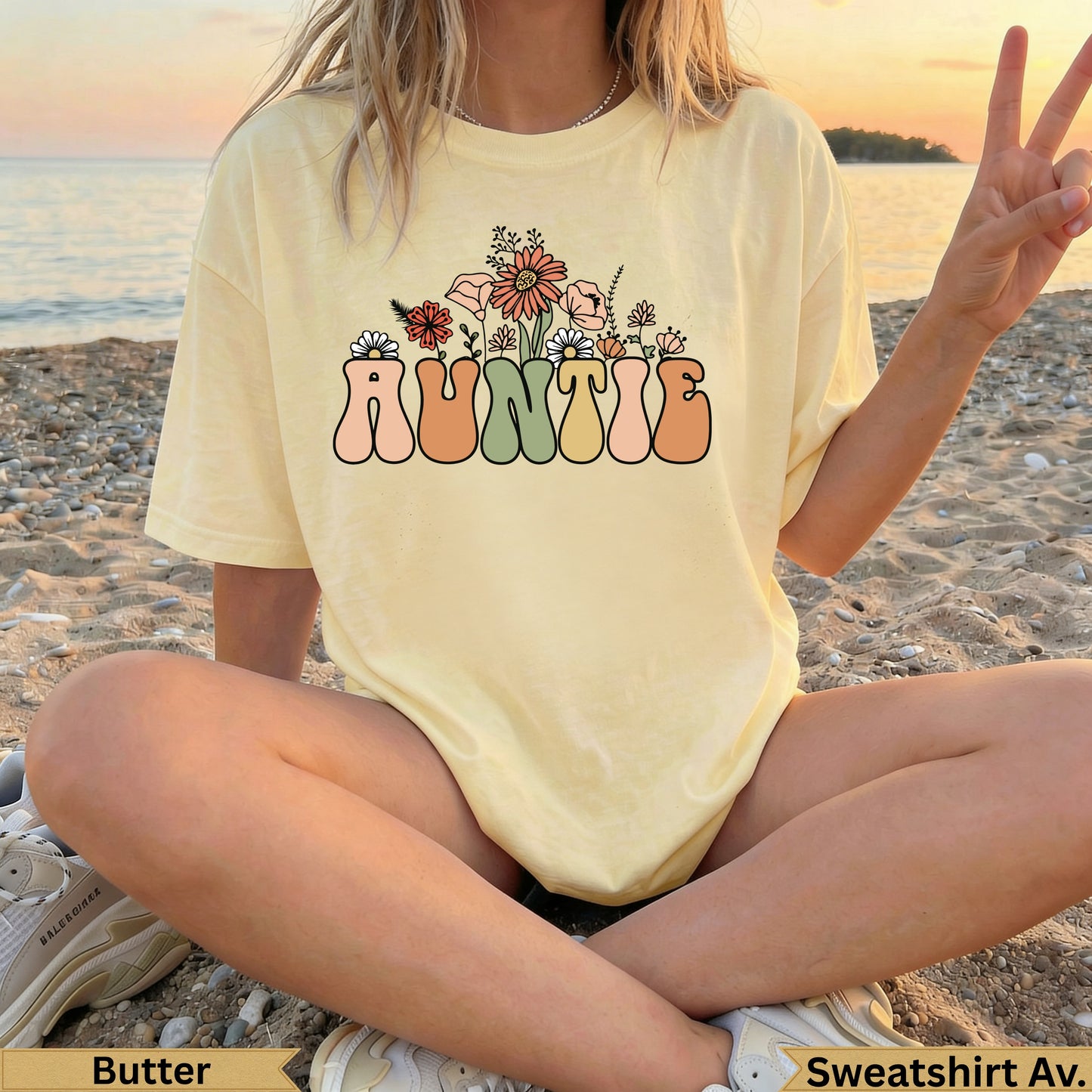 Butter yellow t-shirt with "AUNTIE" in floral lettering.