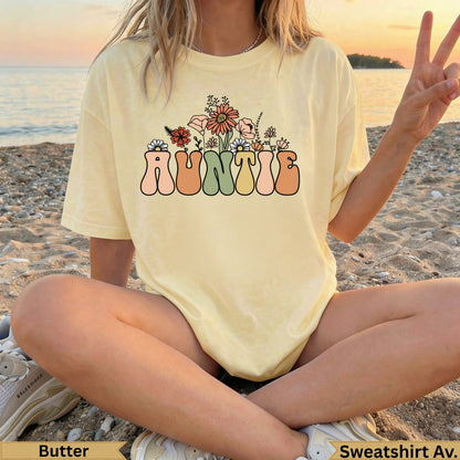 Butter yellow t-shirt with "AUNTIE" in floral lettering.