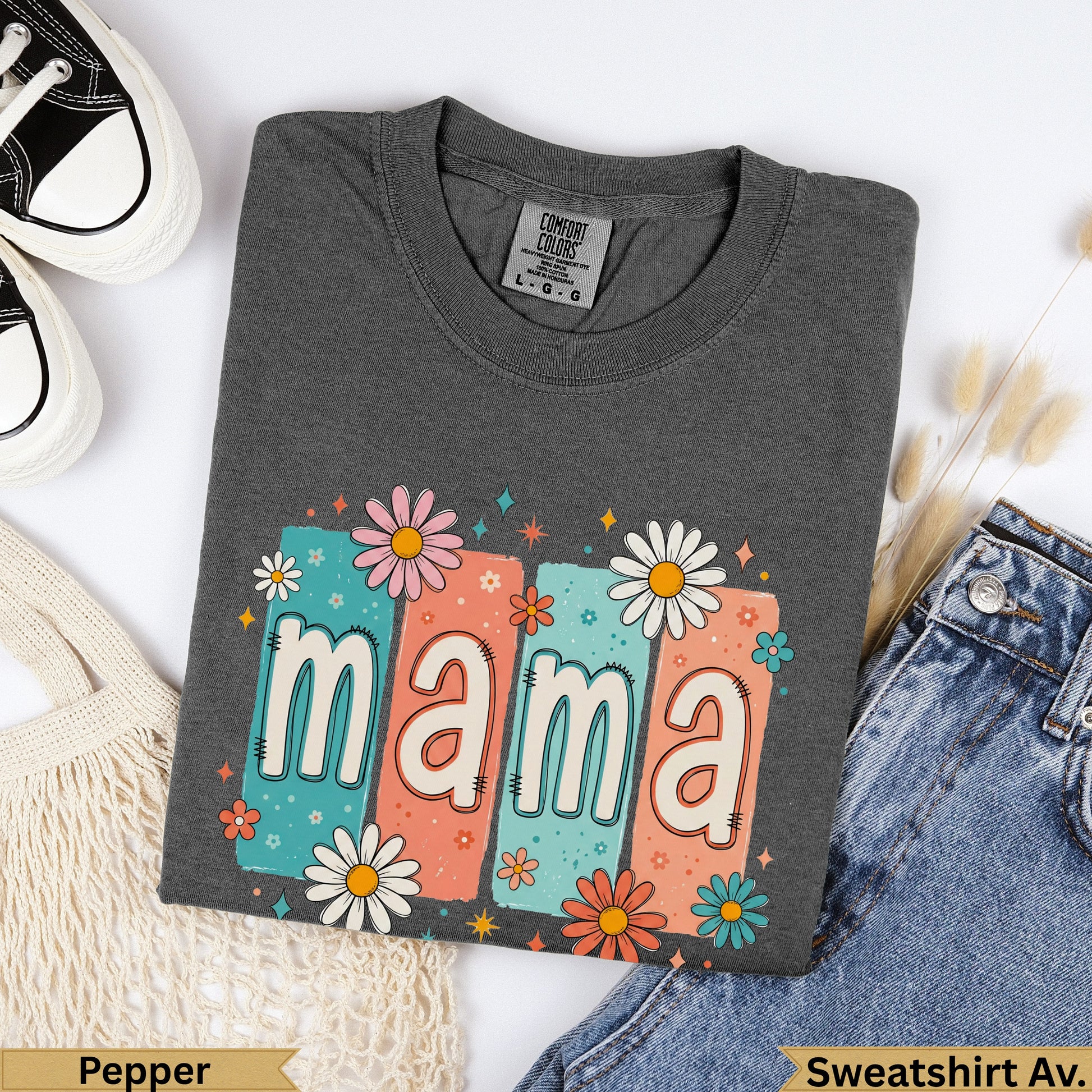 Dark gray t-shirt with "mama" in colorful floral blocks.