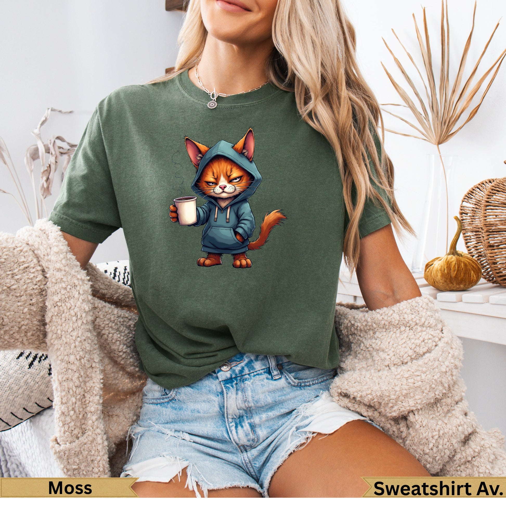 Green hooded sweatshirt featuring a cartoon cat holding a coffee cup.