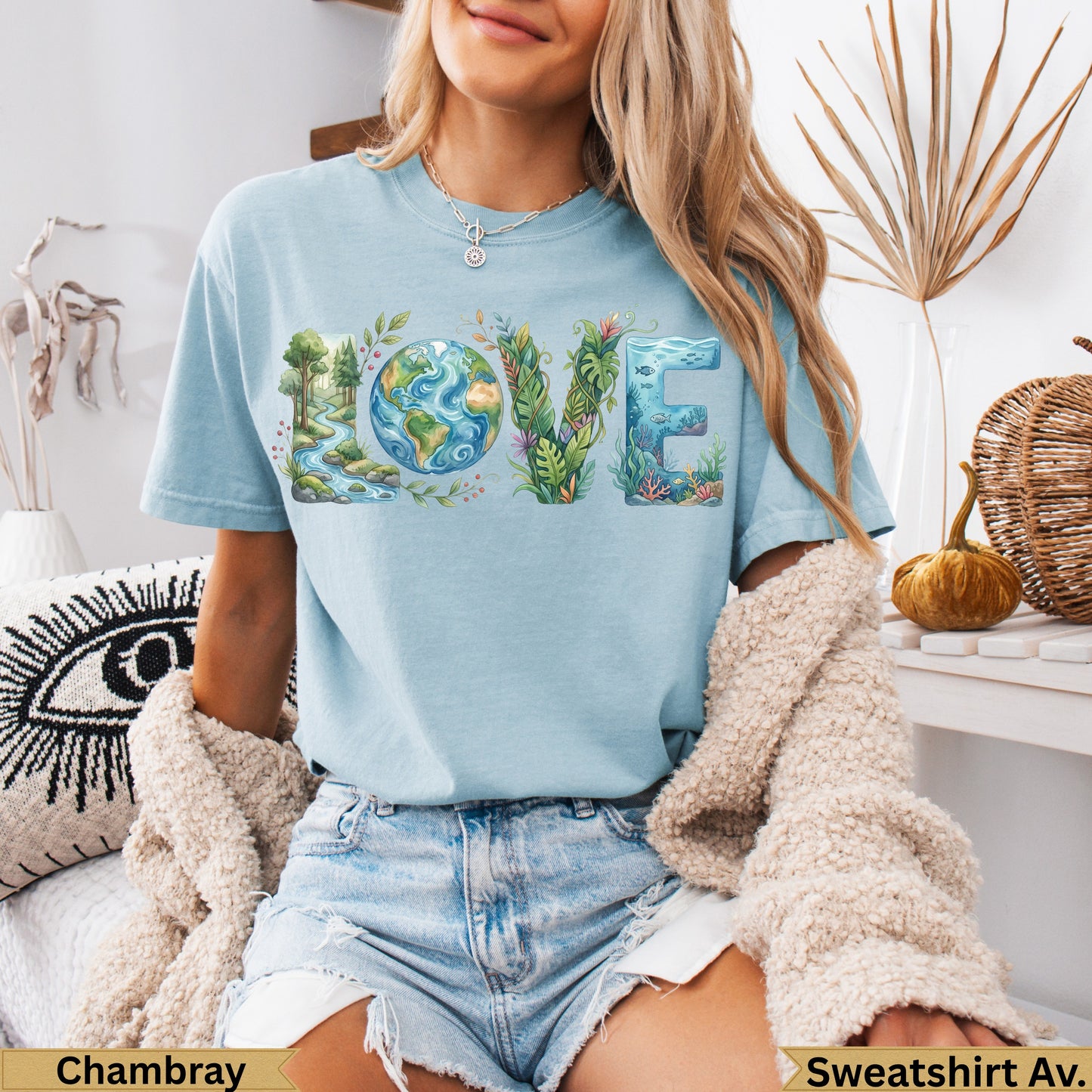 Light blue t-shirt with "LOVE" spelled out in nature-themed illustrations.