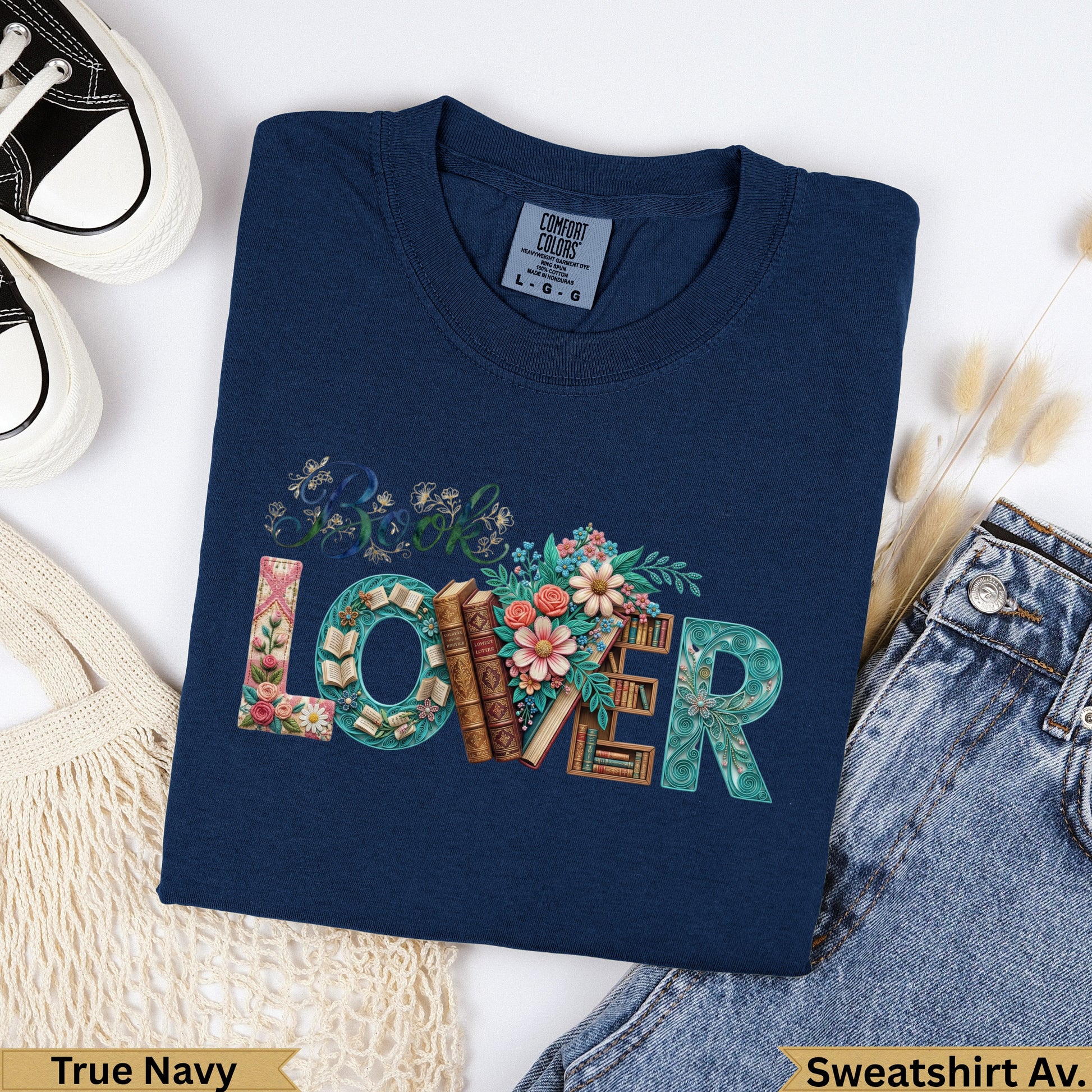 Navy blue sweatshirt with "Book Lover" text design and floral accents.