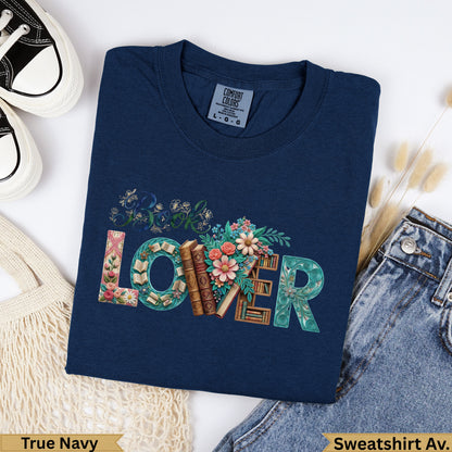 Navy blue sweatshirt with "Book Lover" text design and floral accents.