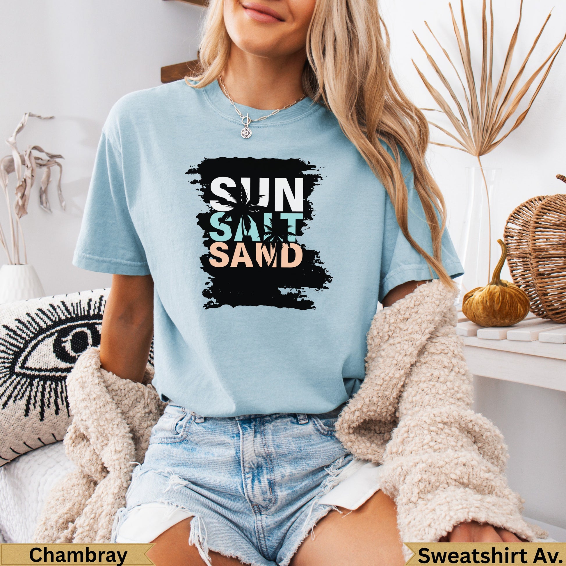 Light blue t-shirt with "SUN SALT SAND" graphic.