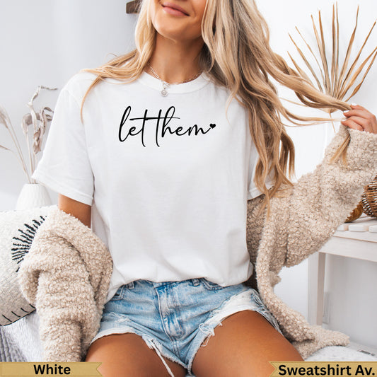 White t-shirt with "let them" text and heart.