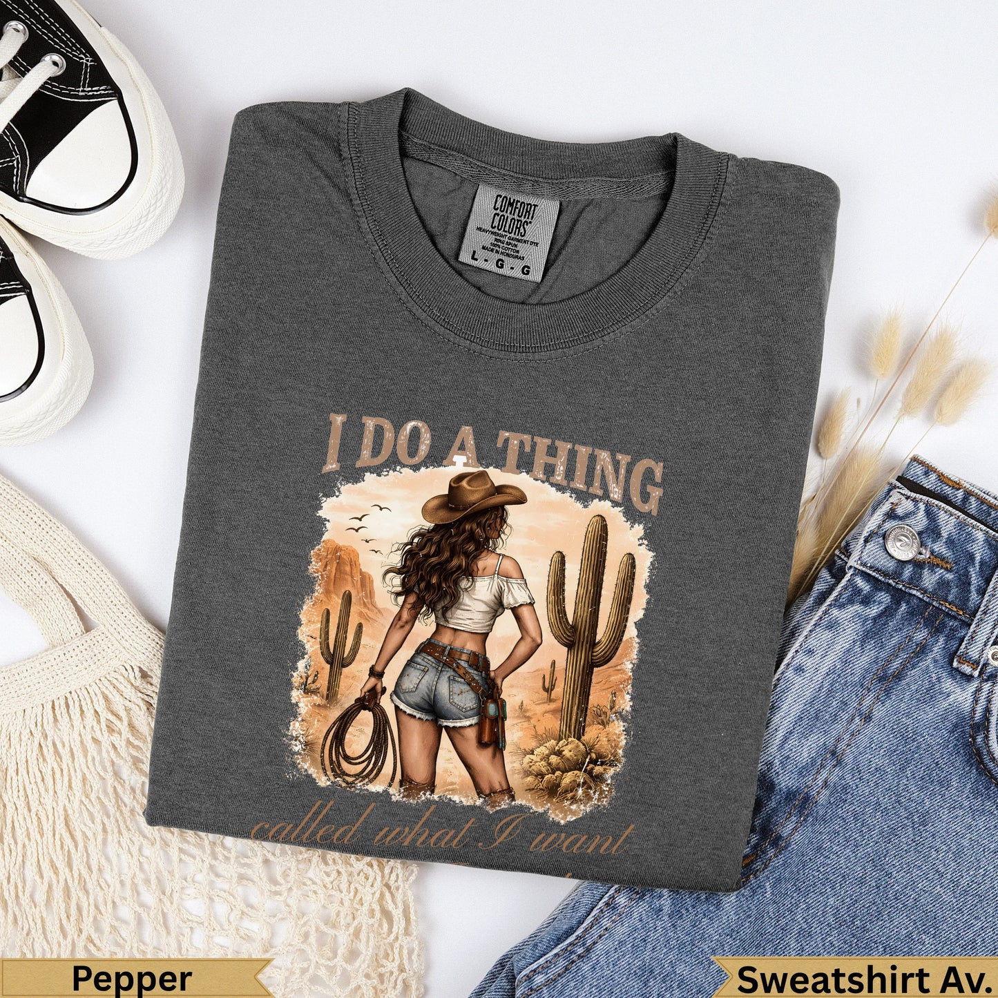 Graphic t-shirt with desert scene and text "I do a thing called what I want."