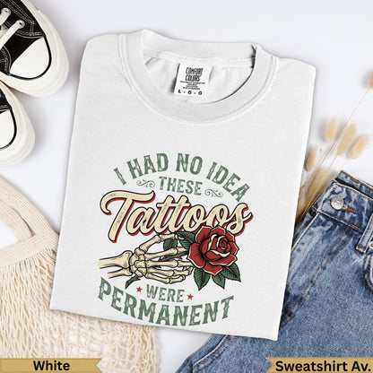 White Comfort Colors t-shirt with "I had no idea these tattoos were permanent" text.