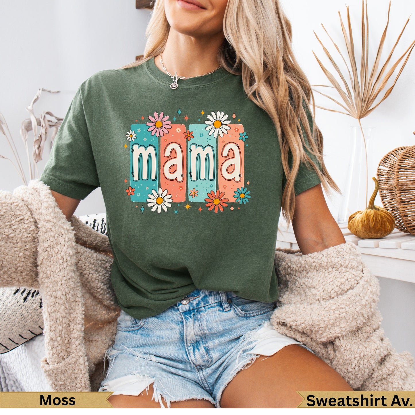 Green t-shirt with "mama" in colorful floral block letters.