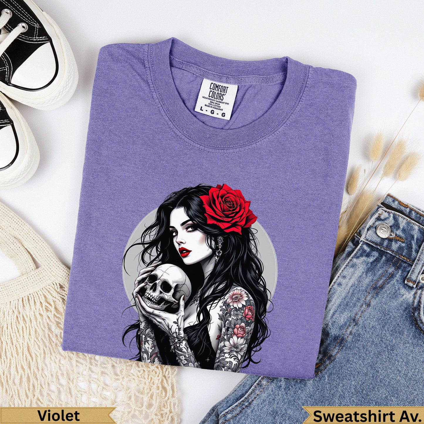 Purple Comfort Colors sweatshirt with tattooed woman holding a skull and a red rose.
