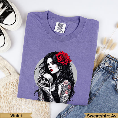 Purple Comfort Colors sweatshirt with tattooed woman holding a skull and a red rose.