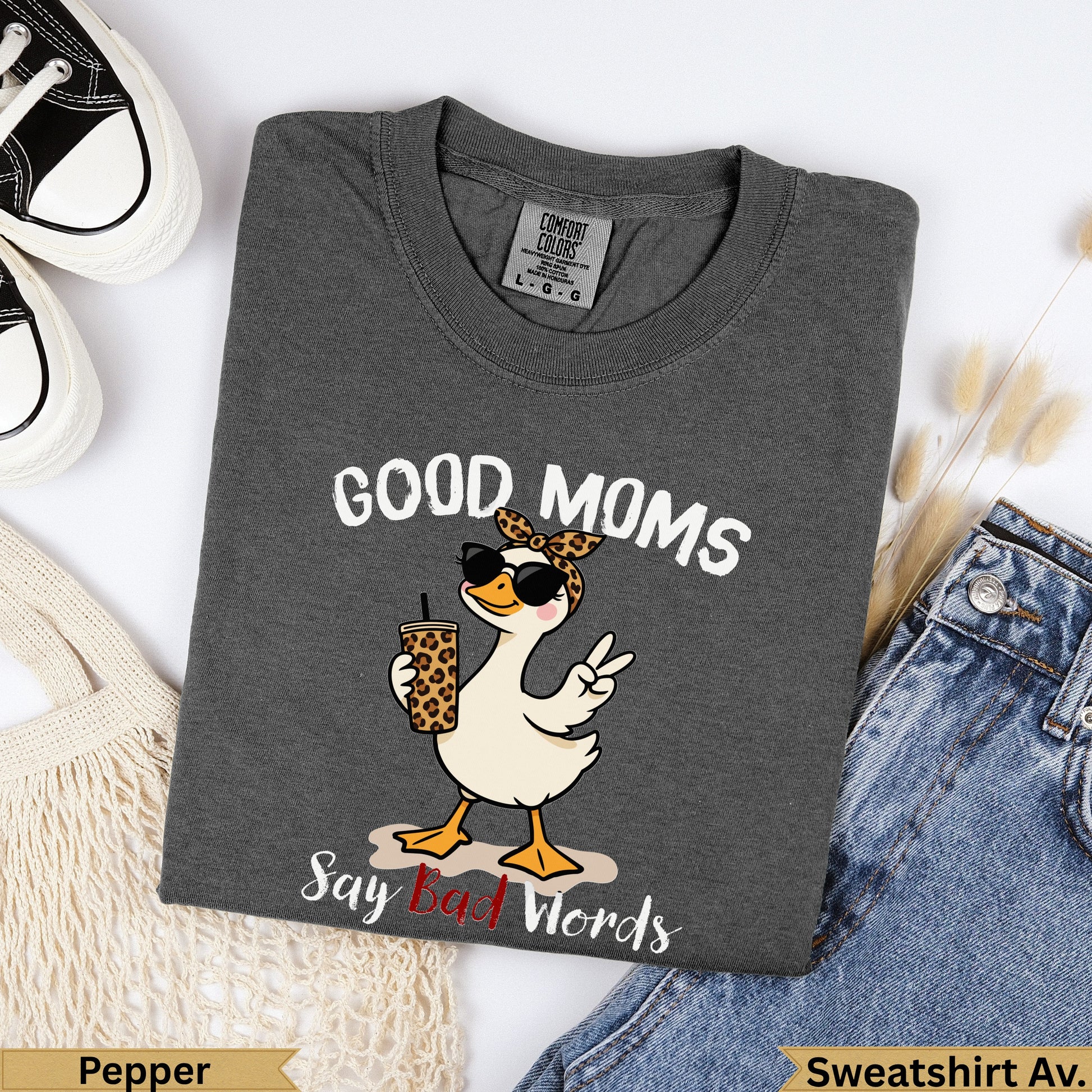 Graphic tee with duck wearing sunglasses, holding drink, saying "Good Moms Say Bad Words".