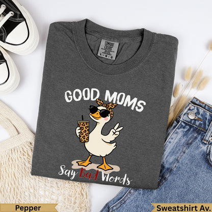 Graphic tee with duck wearing sunglasses, holding drink, saying "Good Moms Say Bad Words".