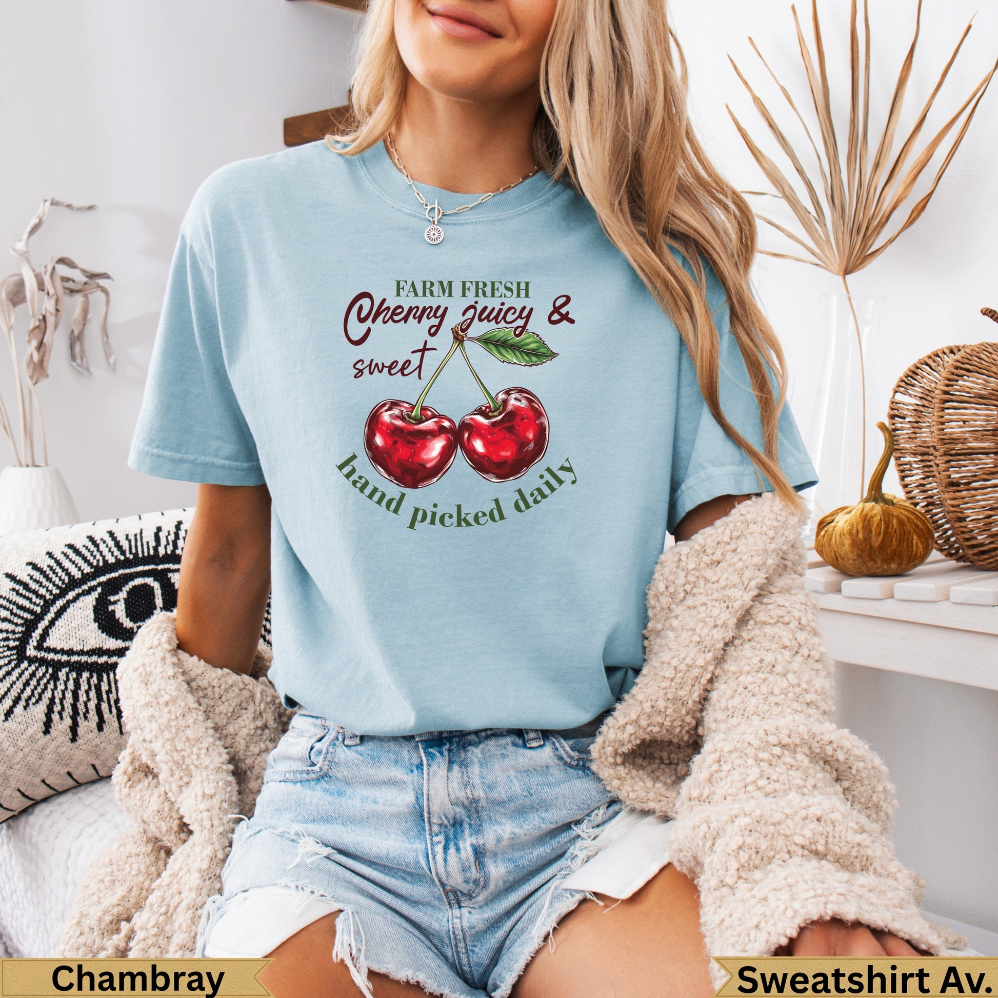 Light blue t-shirt with cherries and text "Farm Fresh Cherry Juicy & Sweet Hand Picked Daily".
