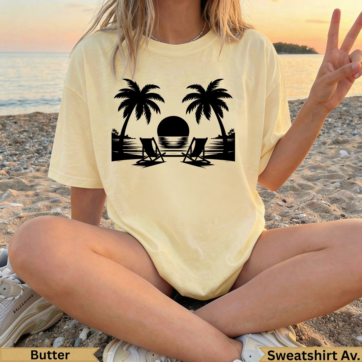Pale yellow t-shirt with palm trees, beach chairs, and sunset graphic.