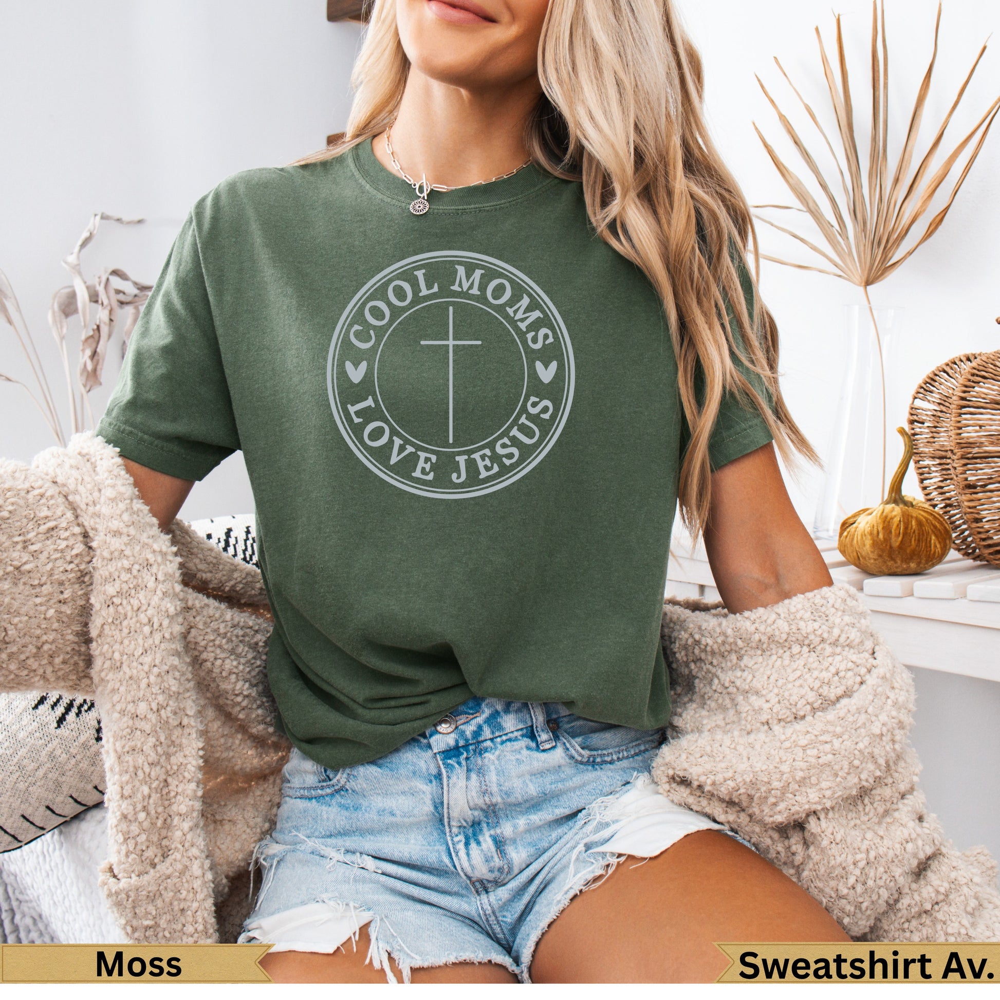 Green t-shirt with "Cool Moms Love Jesus" text and cross graphic.
