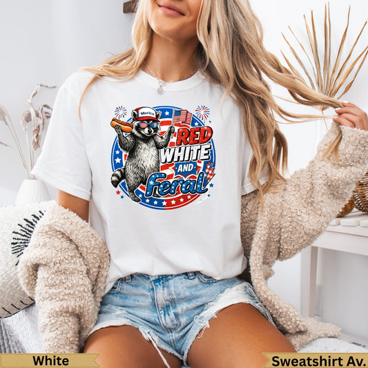White t-shirt with patriotic raccoon holding baseball bat and American flag.