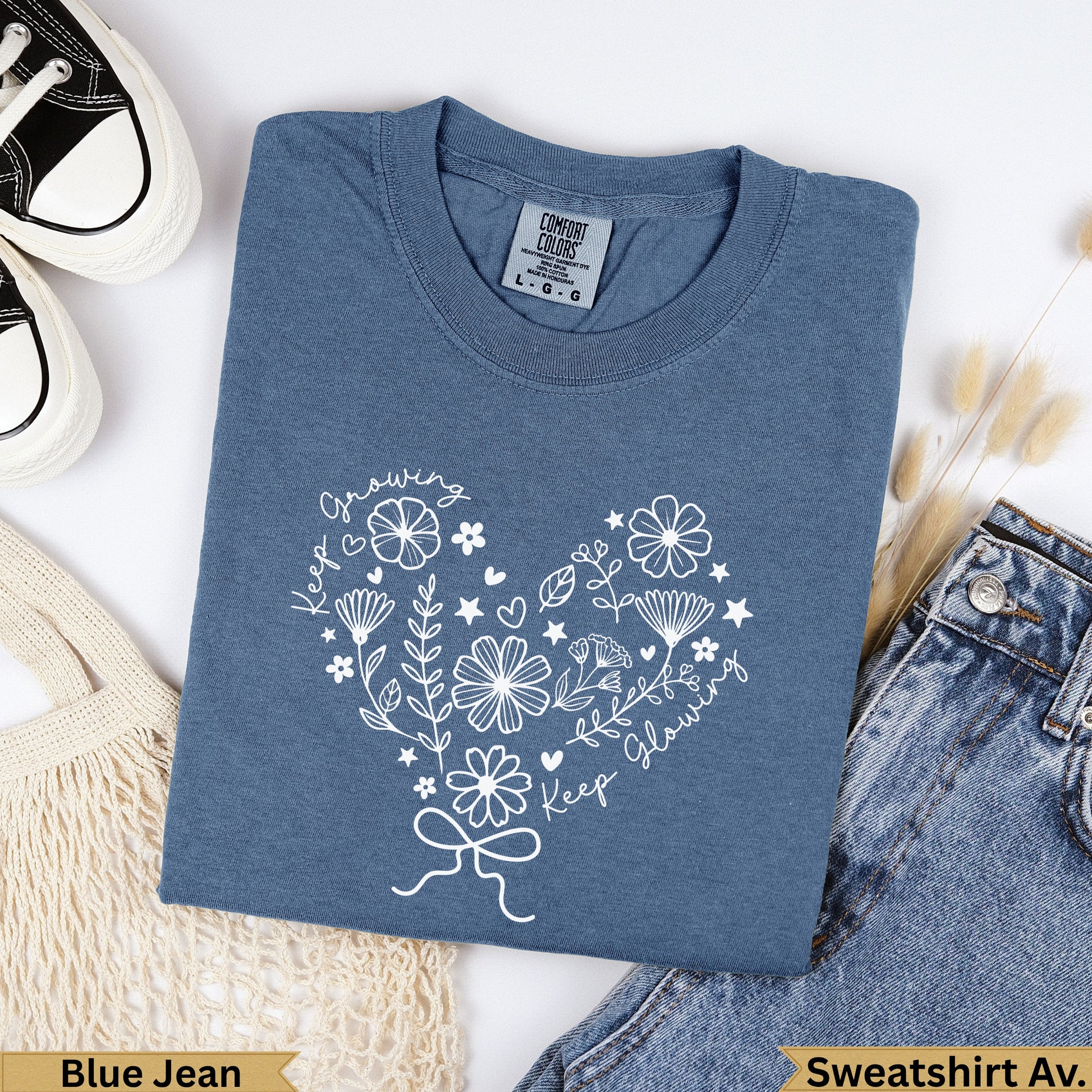 Blue Jean Comfort Colors sweatshirt with a white heart floral design and text.